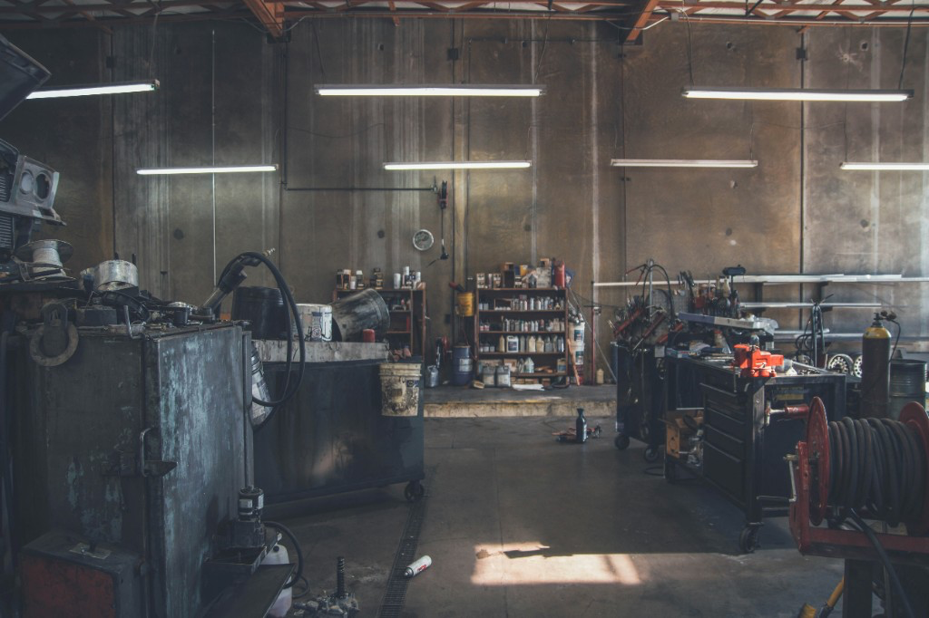 Auto repair shop interior with tools and work areas